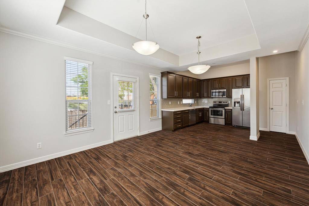 View through Living/Dining room into kitchen