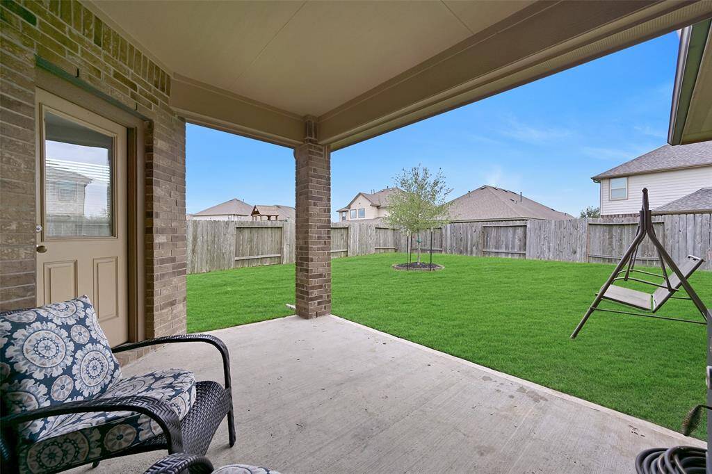 Enjoy outdoor living on the covered back patio, complete with a gas line for easy grill hook-up and a fully fenced backyard with plenty of space to play or garden.