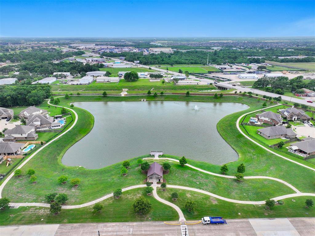 Aerial perspective highlights the inviting Bakers Landing community, featuring scenic walking trails, a serene community pond, and a nearby playground—perfect for outdoor enjoyment and family recreation.