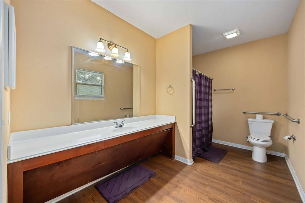 Spacious primary bath  a large vanity, and a convenient walk-in shower.