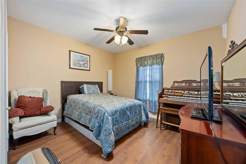 Cozy guest bedroom with ample natural light—perfect for visitors.