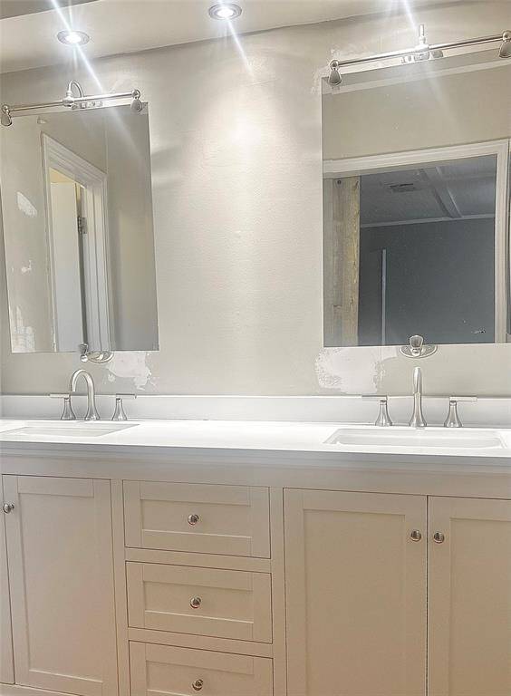 Close up of new upstairs master vanity with updated lighting & mirrors