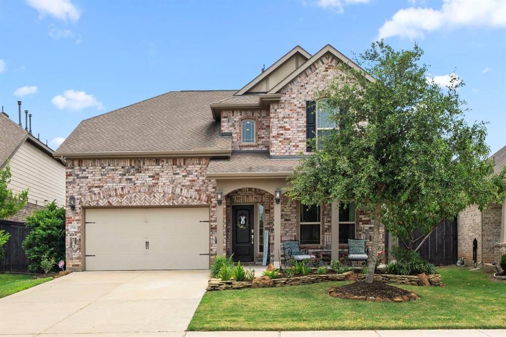 Welcome to Harvest Green! The front brick elevation with a covered front porch that is great for relaxing, offers great curb appeal to come home to every day.