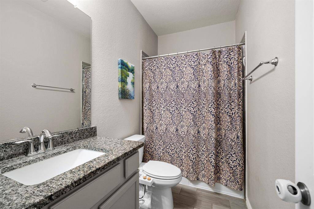 Bathroom 2 is located on the 1st floor just off of Bedroom 2 and has access from the hallway just off of the foyer
