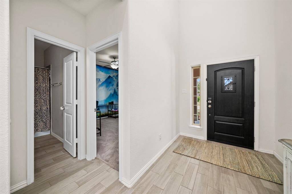 The guest bedroom and bathroom #2 is located just off the foyer.