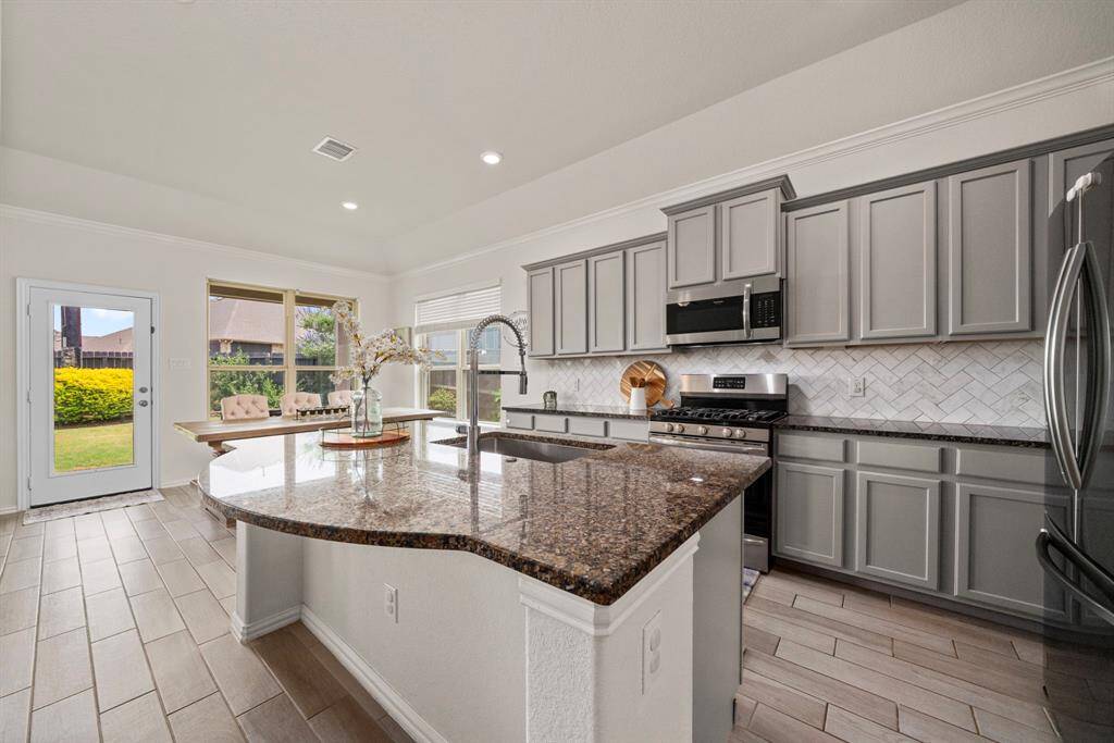 The kitchen is land is enormous and can fit several barstools for another dining area or social gathering seating area.