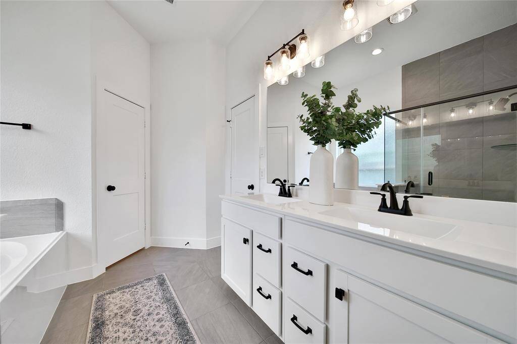 Check out the spa-like bath with dual sinks and a large walk-in closet.