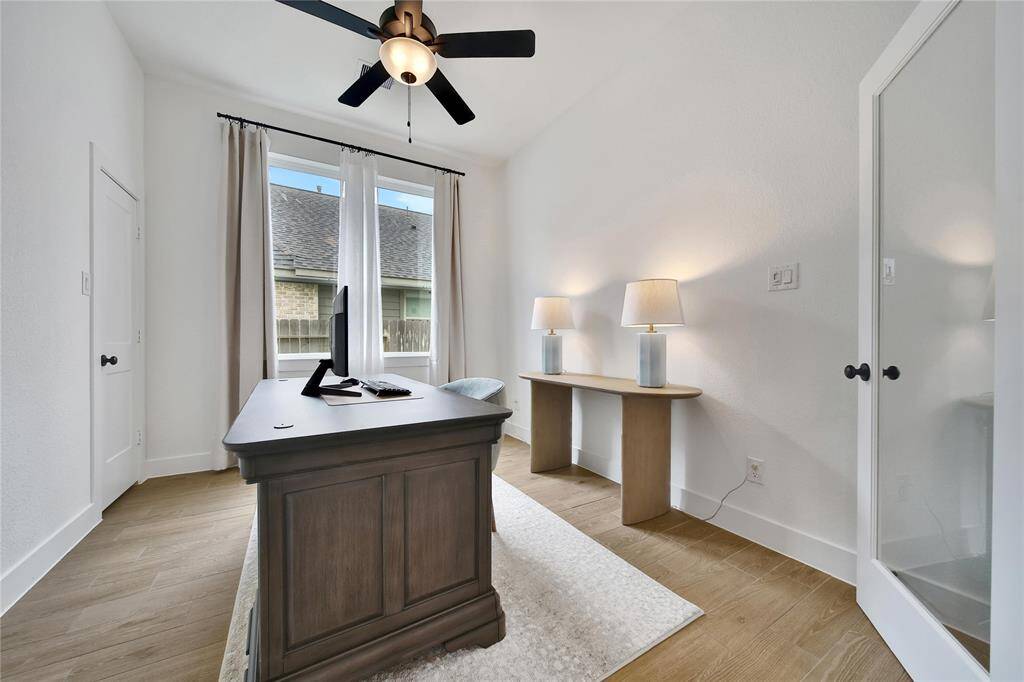 The executive study is on your left as you enter. With glass French Doors and a high ceiling this is a beautiful and productive work space.