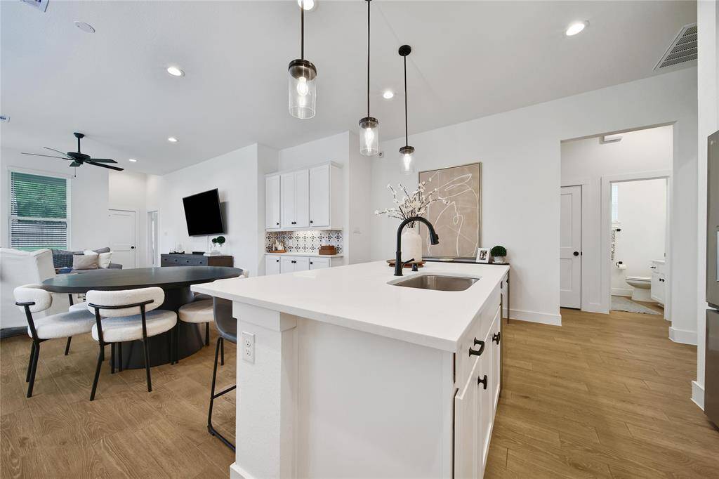 This kitchen is a delight to work in with great counter space and storage including a walk-in pantry.