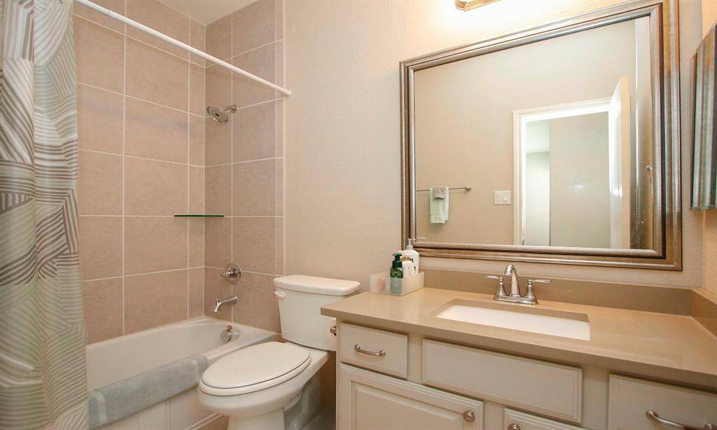 The second full bathroom is also on the lower level.   Upgraded counter top with under mount sink and full tile bath/shower.