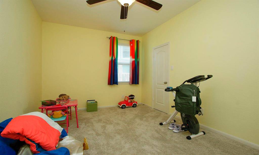The second bedroom is currently used a kids play area.   All bedrooms have ample closet space and ceiling fans.