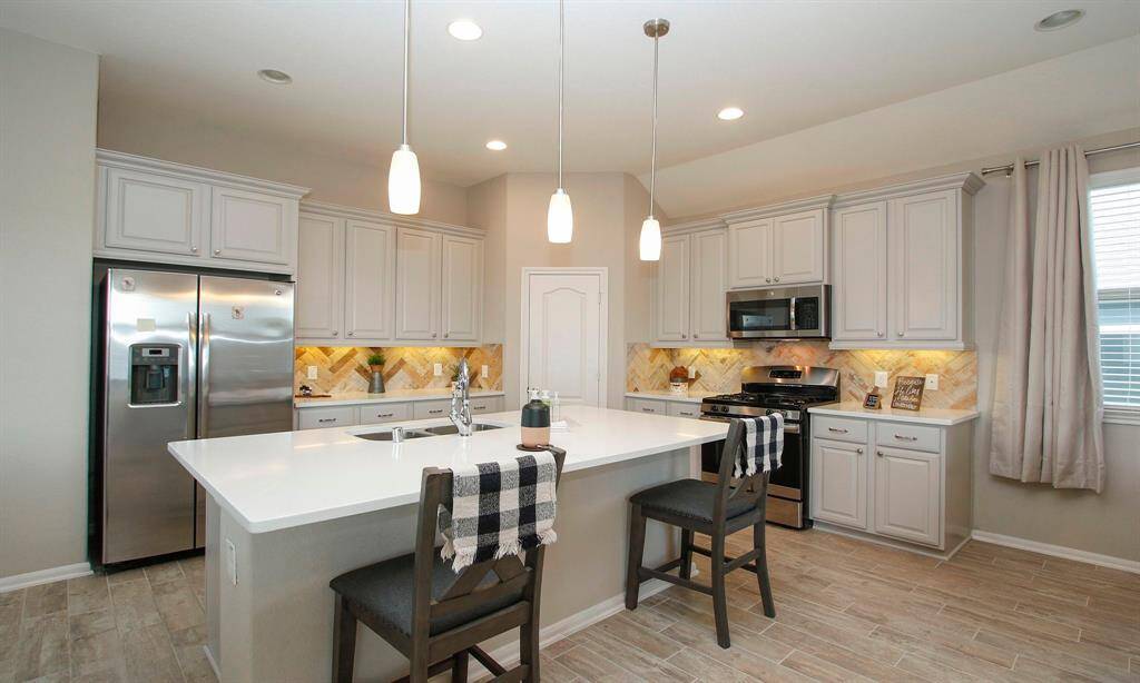 This spacious kitchen is on the main floor.    kitchen has all  stainless steel appliances.
