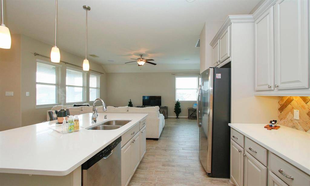 All lower cabinetry has self-closing drawers.   Notice the hazel bone backsplash.