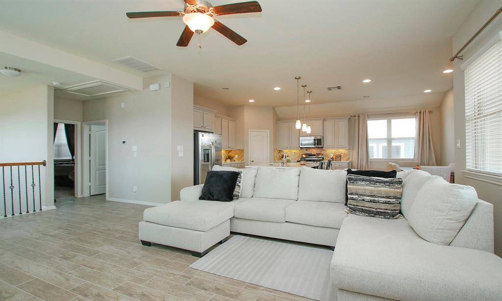 The open concept makes this space feel even bigger.    Lots of windows lets in plenty of natural light.