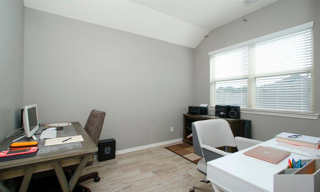This floor also offers an extra room.   Currently being used as a study.