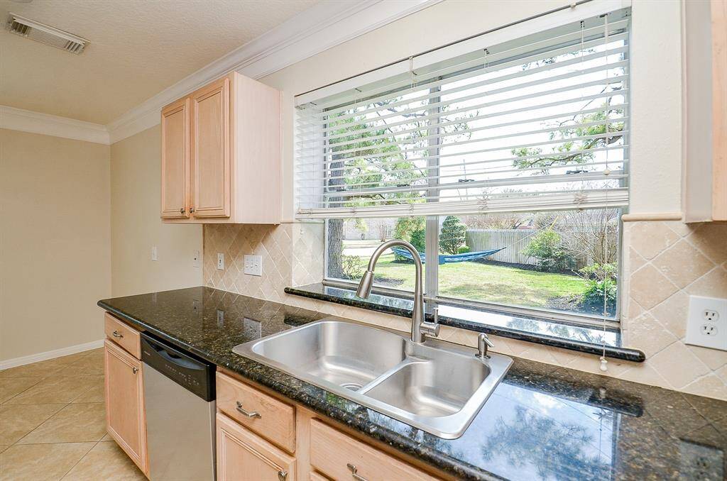 Sink overlooks side yard.
