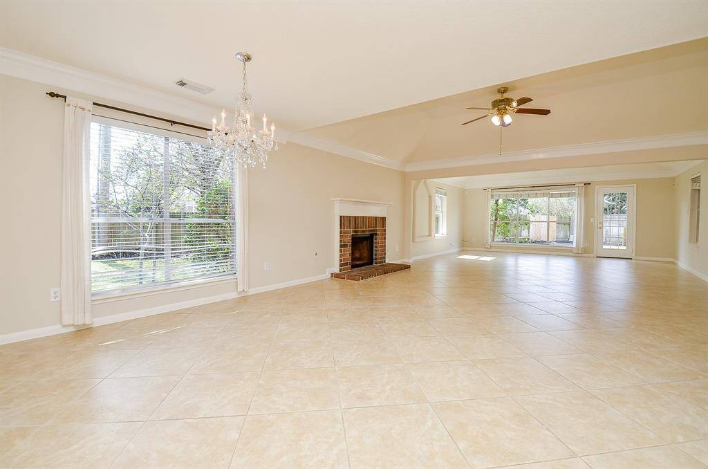 Large and open main living space features space for formal dining as well as a fireplace!