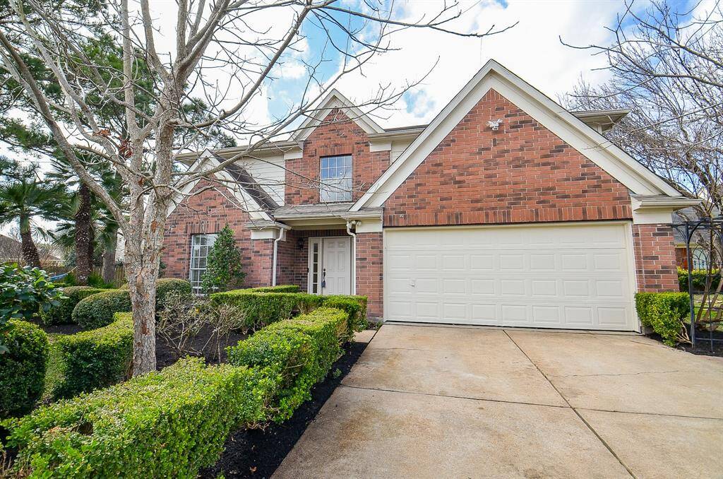 Home features attached 2 car garage and well maintained landscaping.