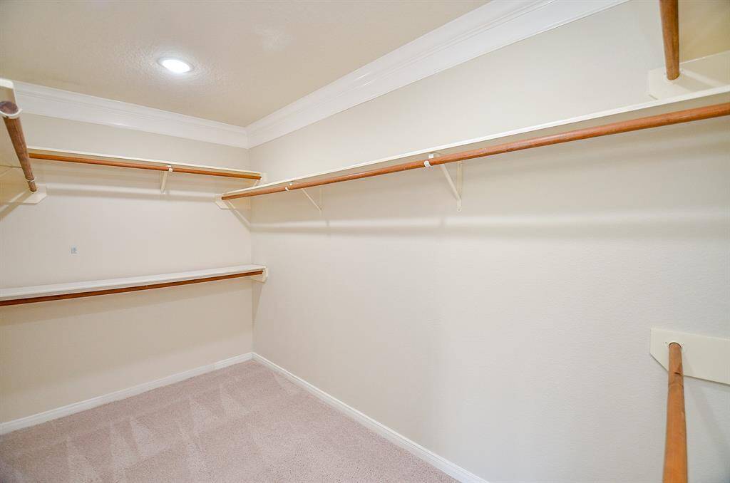 Large primary walk-in closet.