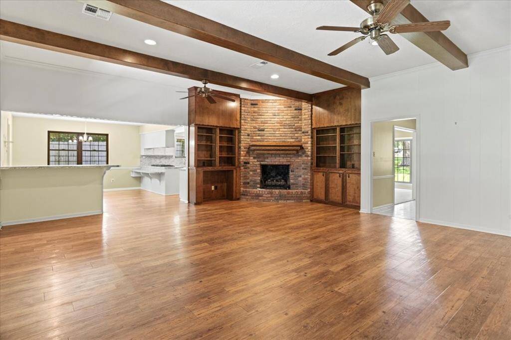 Family room with beams and fireplace
