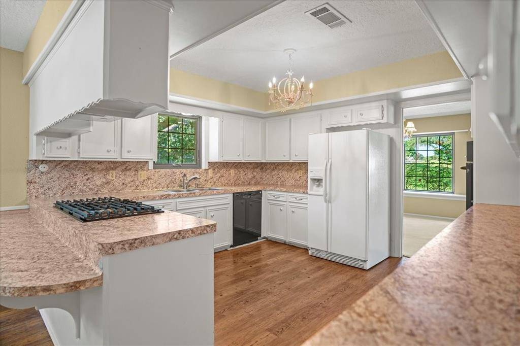 Spacious kitchen with tons of storage and breakfast bar