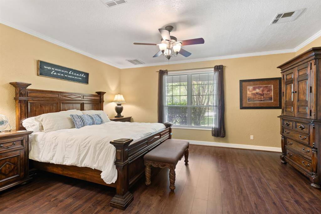 Primary bedroom with high ceilings and lots of natural light.