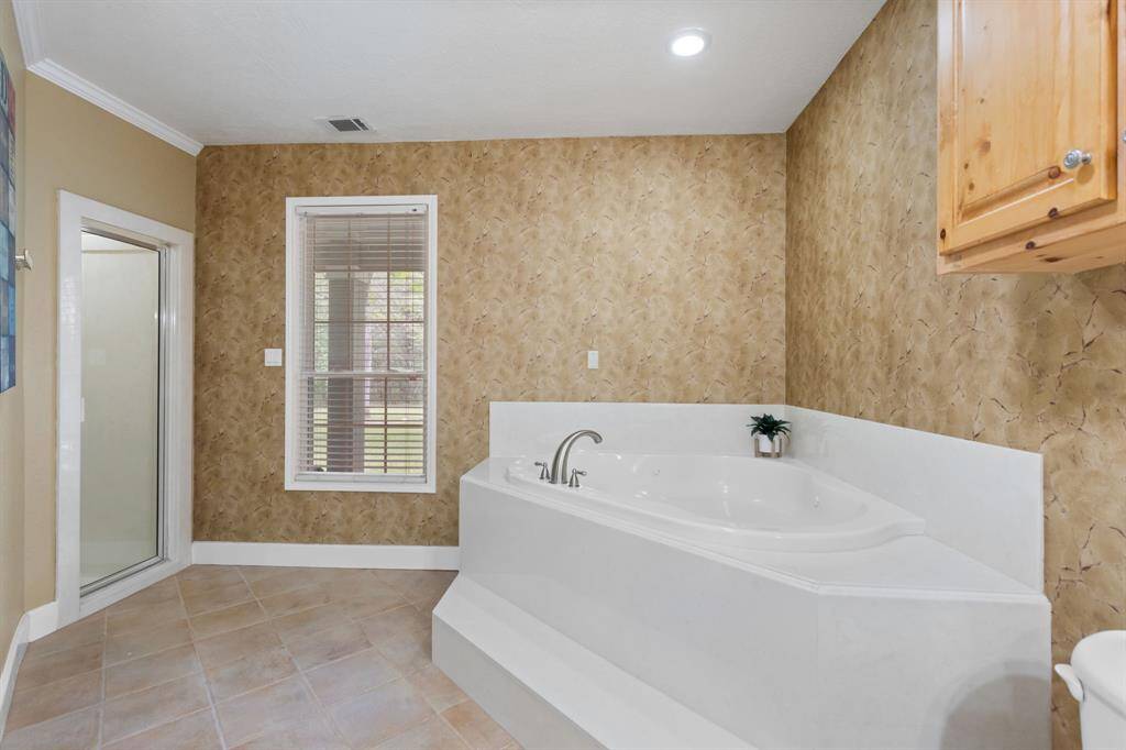 Separate walk in shower and soaker tub.