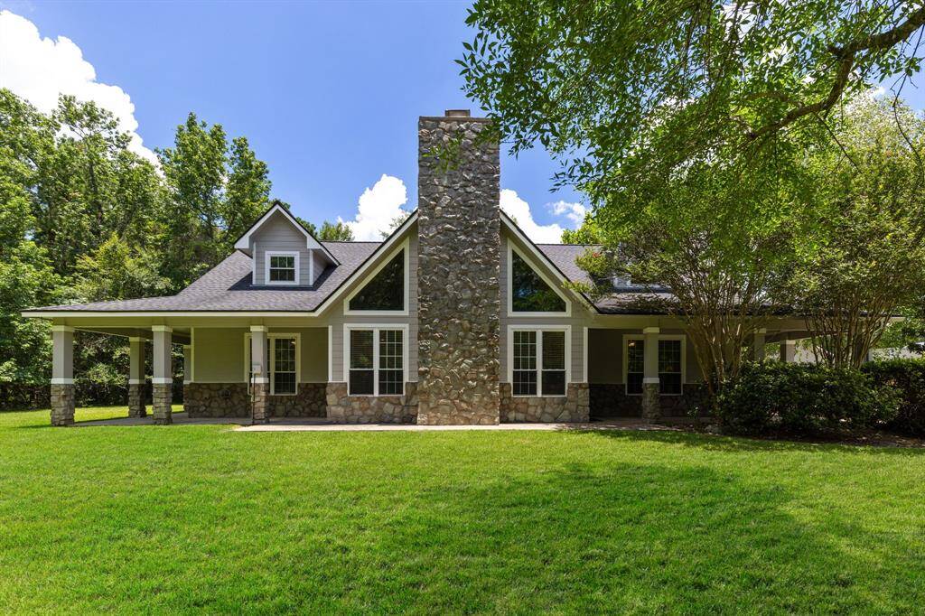 31014 Chelsie Place located minutes from Woodlands Parkway/FM 2978. Gorgeous Woodlane Forest offering 2.5764 acres! 4 bedrooms with double primary and 2 full baths down plus 2 beds up with full bath and loft! Don't miss the wrap around porch and a pond stocked full ready to fish!