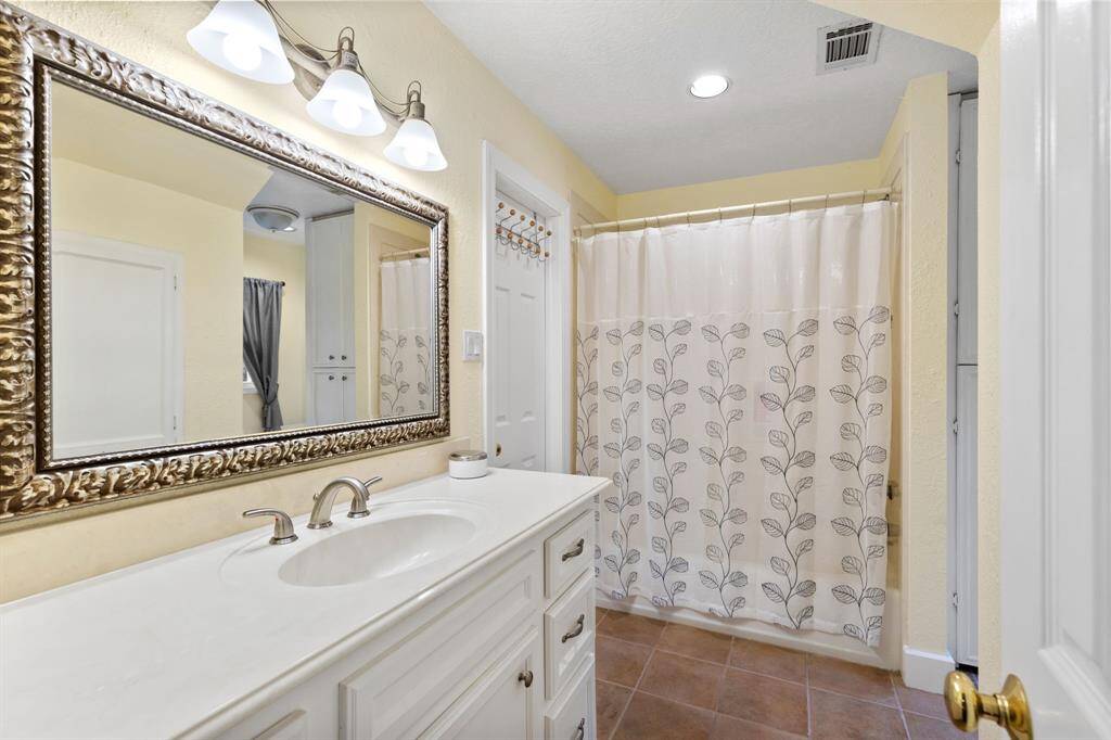 3rd full bath is upstairs and has tons of storage and privacy.
