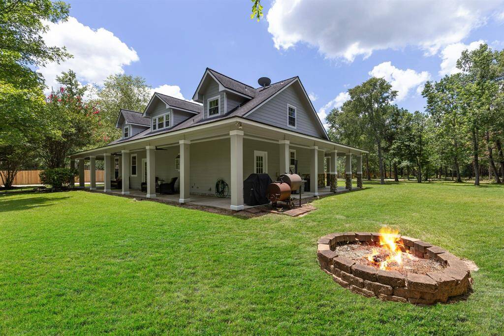 Firepit located off the corner of the home along with the grilling area.