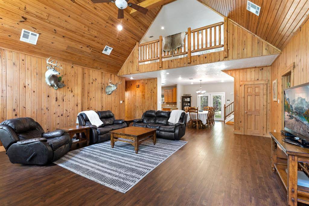 Two story vaulted ceiling with loft overlooking family room. Create your own vision on this stunning room. Floors are newer.
