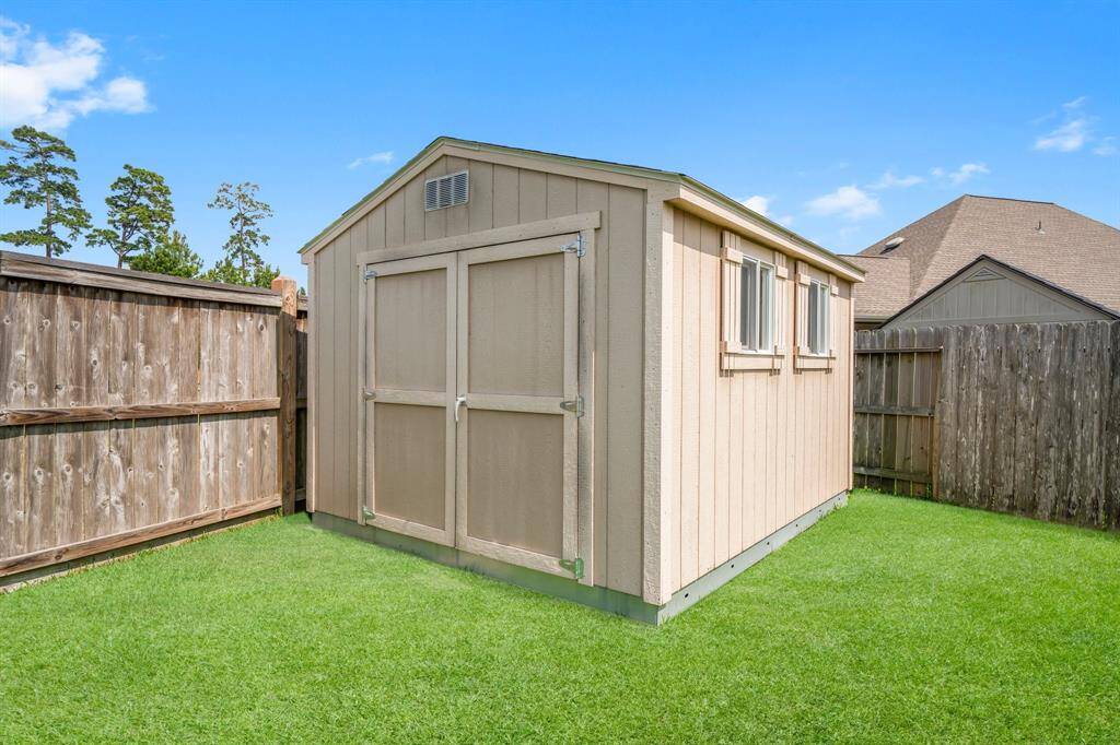 Need storage? This fantastic shed conveys with the home and offers space for tools, toys, and outdoor essentials.
