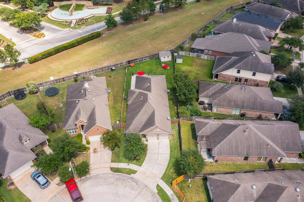 This drone shot showcases the home’s prime location tucked in a quiet cul-de-sac, highlighting the private backyard with no rear neighbors for added peace and tranquility.