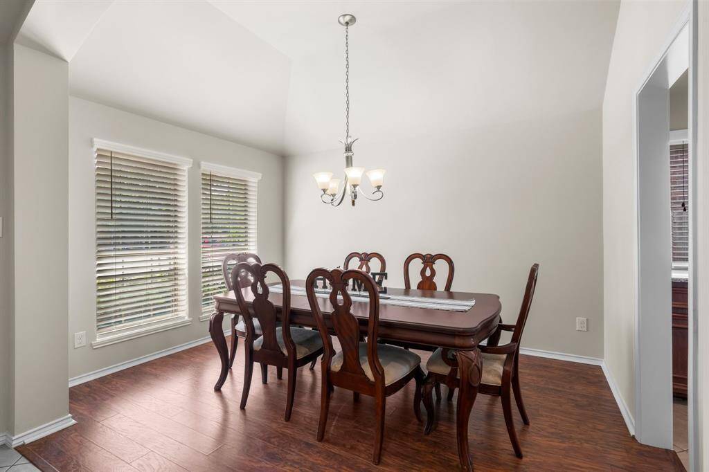 Located at the front of the home, the formal dining room offers timeless charm, abundant natural light, and an inviting space for gatherings both big and small.