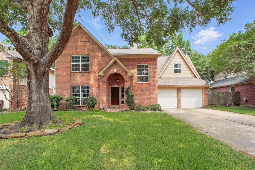Welcome to 3218 Barkers Forest Lane! Charming two-story brick home with classic curb appeal.