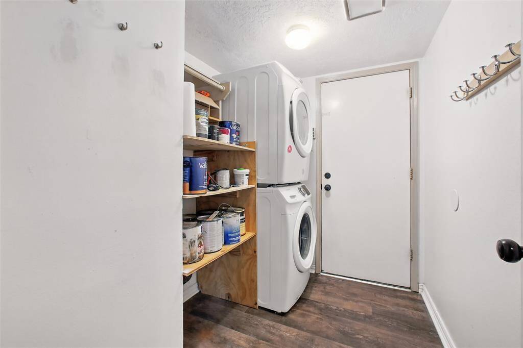 The laundry room is complete with washer and dryer, extra storage space and a drop zone. This home is truly move-in ready.