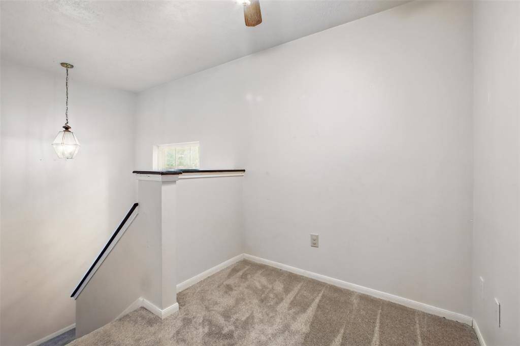 Upstairs offers a study or reading nook area.