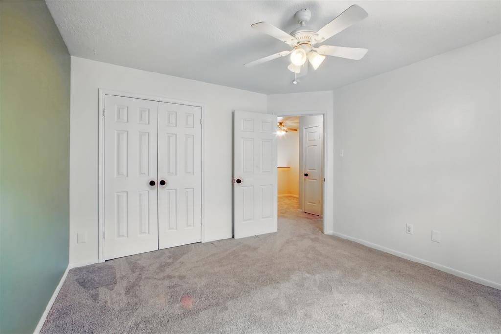 Secondary Bedroom 1 of 3. All secondary bedrooms are roomy and have great closet space.
