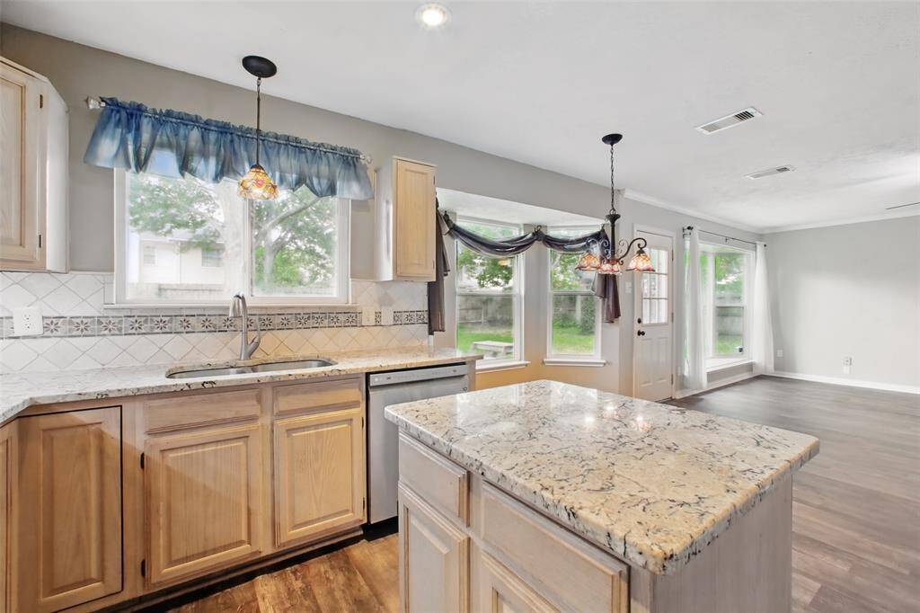 The kitchen seamlessly flows into the breakfast area and family room.