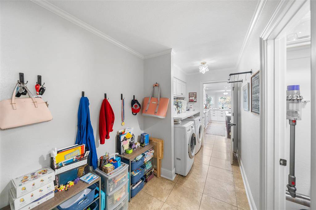 Before we head outside, this large Mudroom & Laundry area with an Extra Storage Closet is so convenient!