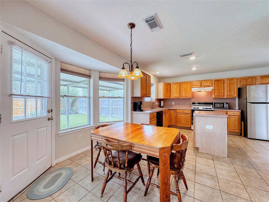Breakfast room with built-in workstation to the side