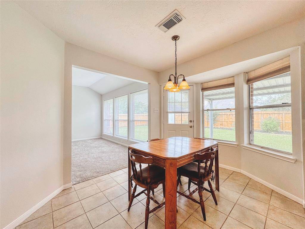 Breakfast room with built-in workstation to the side