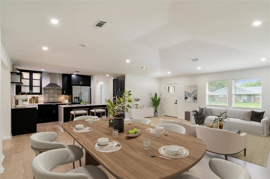 this photo is digitally stage. Open floor Plan. Living, Dining and Kitchen