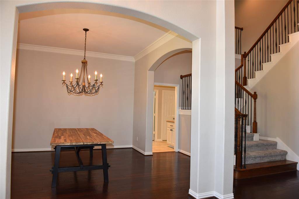 open dinning room next to stairs way and entrance