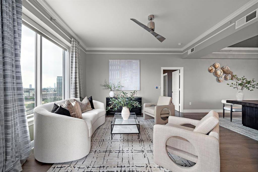 Defined by layered trim work and a balanced layout, the room offers visual clarity while allowing for multiple furniture configurations.
