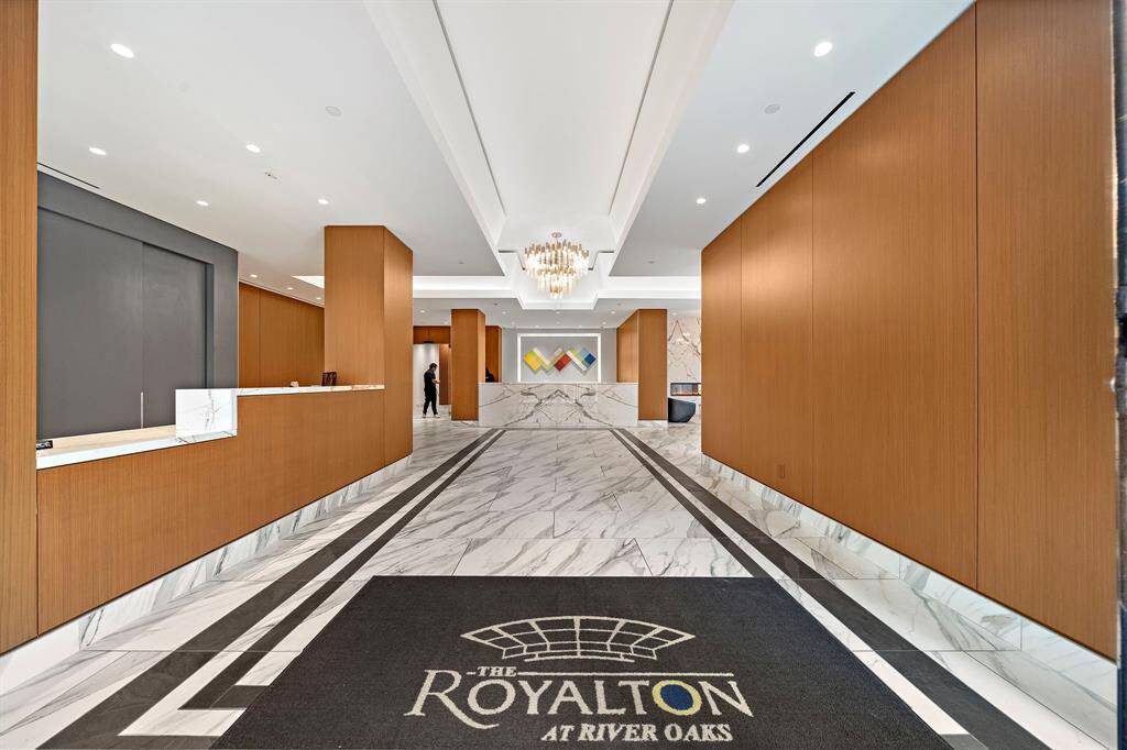 The Royalton at River Oaks welcomes residents with a grand lobby entrance, where marble flooring, custom paneling, and a full-time front desk set a refined first impression.