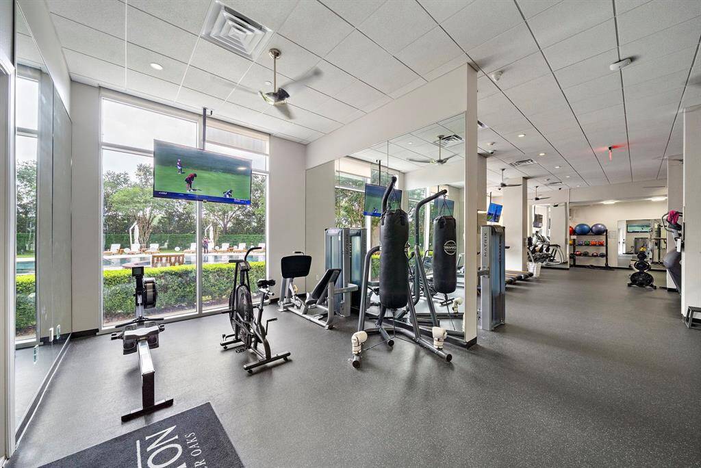 The Royalton’s fully equipped fitness center offers a range of cardio and strength training zones, with floor-to-ceiling windows overlooking the pool and grounds.