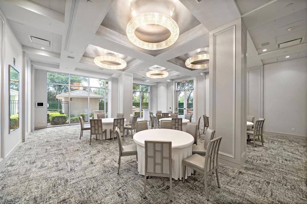 The Royalton’s elegant event room is designed for entertaining or private gatherings, with high ceilings and wall-to-wall windows framing the grounds.