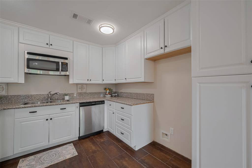 These are wood look tile floors and these cabinets go all the way to the ceiling for extra storage.  No wasted space here.