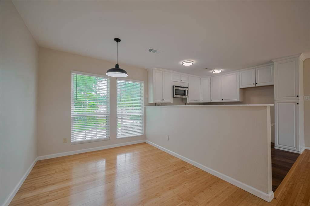 A full size dining room that could accomodate a table for eight or ten.